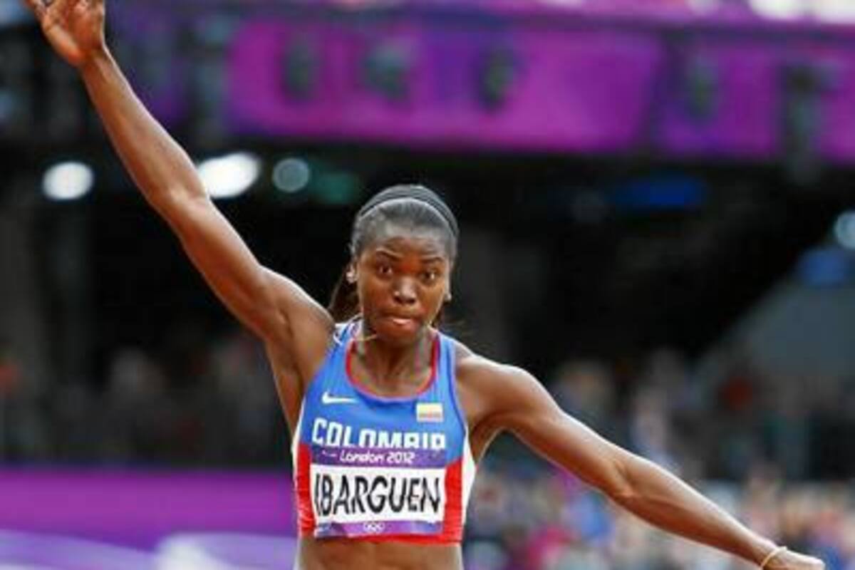 Con un salto de 14 metros y 28 centímetros, y un segundo salto de 14 metros con 42 centímetros, la colombiana Catherine Ibargüen clasificó a la final de salto triple de los Juegos Olímpicos. (Foto: EFE / VANGUARDIA LIBERAL)