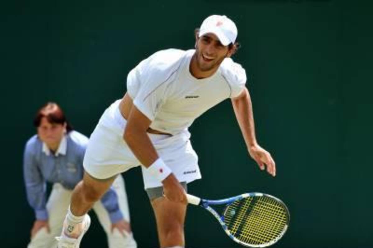 Juan Sebastián Cabal y Robert Farah (atrás) vencieron 2-6, 6-2, 21-19 a la dupla conformada por el pakistaní Aisam Qureshi y el indio Rohan Bopanna, quienes eran los cuartos favoritos al título, y avanzaron a la segunda ronda en el torneo de dobles de Wimbledon. (Foto: AFP / VANGUARDIA LIBERAL )