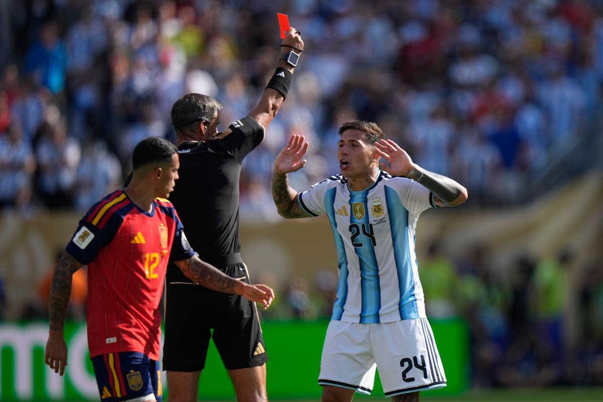 Referee Slavko Vincic, of Slovenia, shows a red card to Argentina's Enzo Fernandez (24) during the World Cup final soccer match between Spain and Argentina in East Rutherford, N.J., near New York, Sunday, July 19, 2026. (AP Photo/Frank Franklin II)