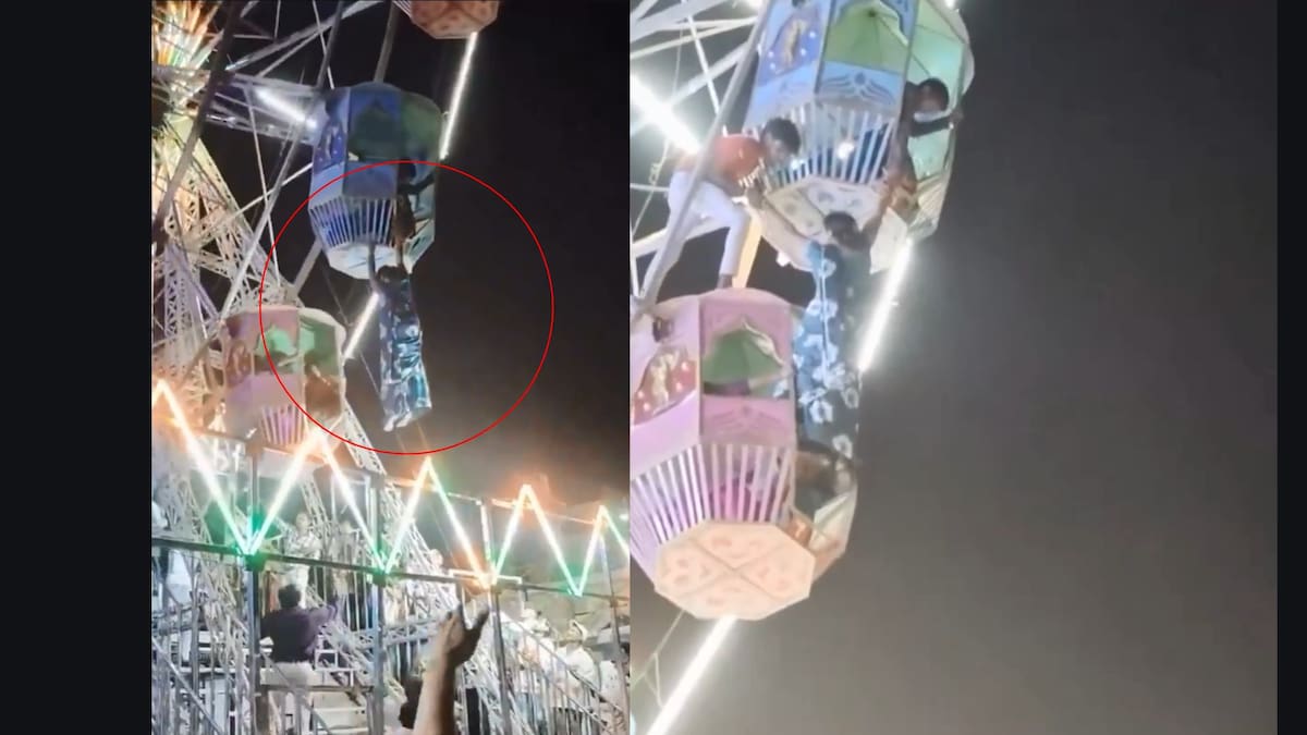 Instantes de tensión cuando un trabajador trepa la noria para poner a salvo a la mujer en plena feria de Bhatapara.