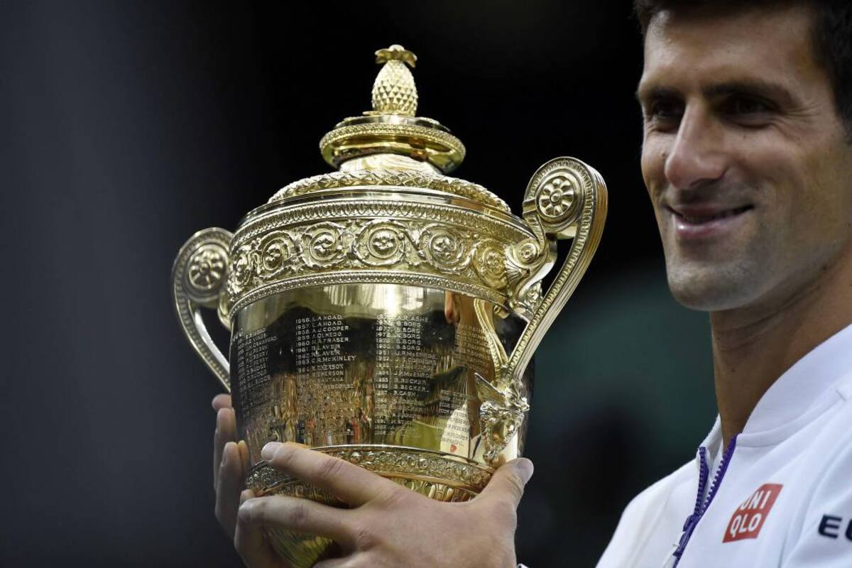 El serbio Novak Djokovic no pudo ocultar su felicidad por el título, pues además del trofeo le entregó 1,88 millones de libras (2,6 millones de euros). (Foto: AFP / VANGUARDIA LIBERAL)