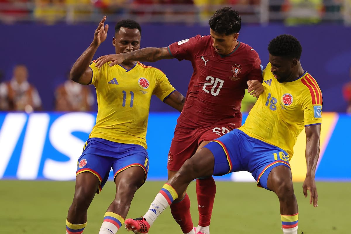 MIAMI (United States), 27/06/2026.- Joao Cancelo of Portugal (C) in action against Jhon Arias (L) and Jefferson Lerma (R) of Colombia during the FIFA World Cup 2026 group stage match Colombia against Portugal, in Miami, Florida, USA, 27 June 2026. EFE/EPA/CRISTOBAL HERRERA-ULASHKEVICH