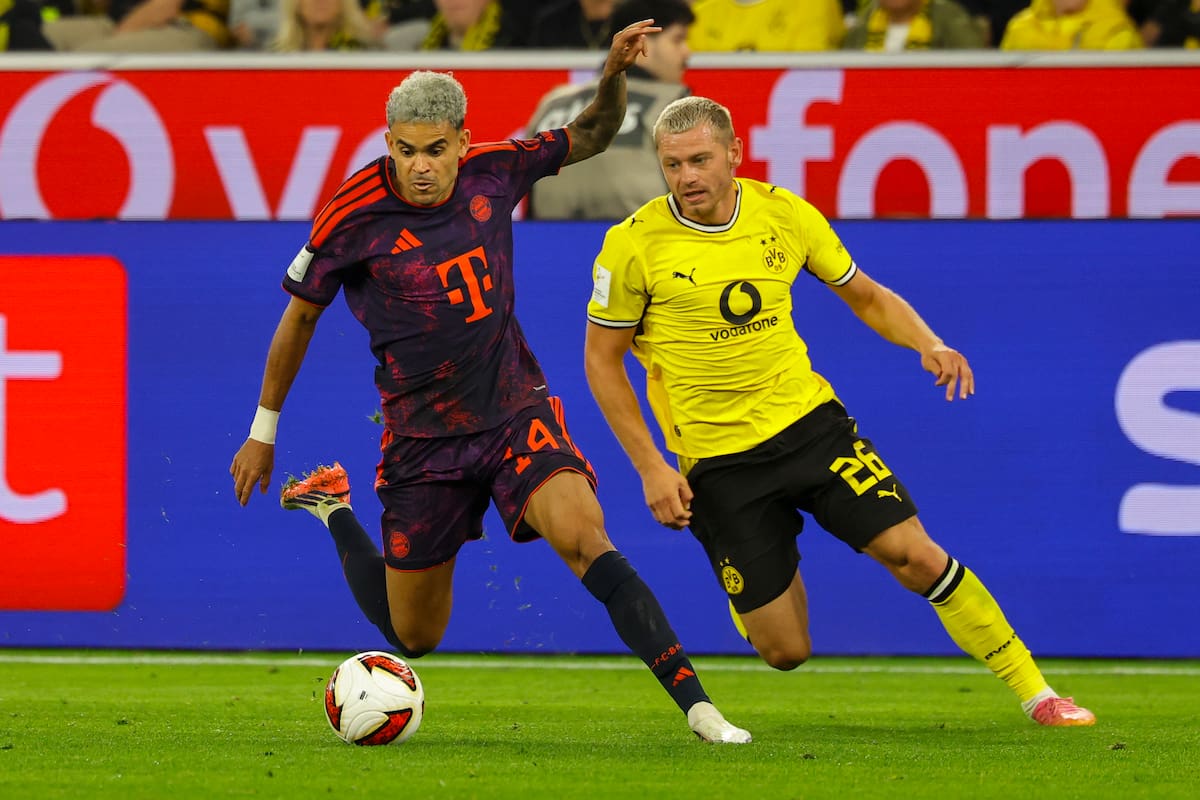 DORTMUND (Germany), 22/08/2026.- Luis Diaz of Munich (L) in action against Julian Ryerson of Dortmund (R) during the Franz Beckenbauer Supercup match between Borussia Dortmund and Bayern Munich, in Dortmund, Germany, 22 August 2026. (Alemania) EFE/EPA/CHRISTOPHER NEUNDORF CONDITIONS - ATTENTION: The DFL regulations prohibit any use of photographs as image sequences and/or quasi-video.