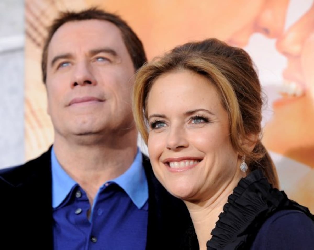 FILE -- A March 25, 2010 file photo shows Kelly Preston, right, a cast member in "The Last Song," with her husband John Travolta at the premiere of the film in Los Angeles. Travolta and Preston's publicist said the couple had a baby boy Tuesday Nov. 23, 2010 in Florida.(AP Photo/Chris Pizzello/file)