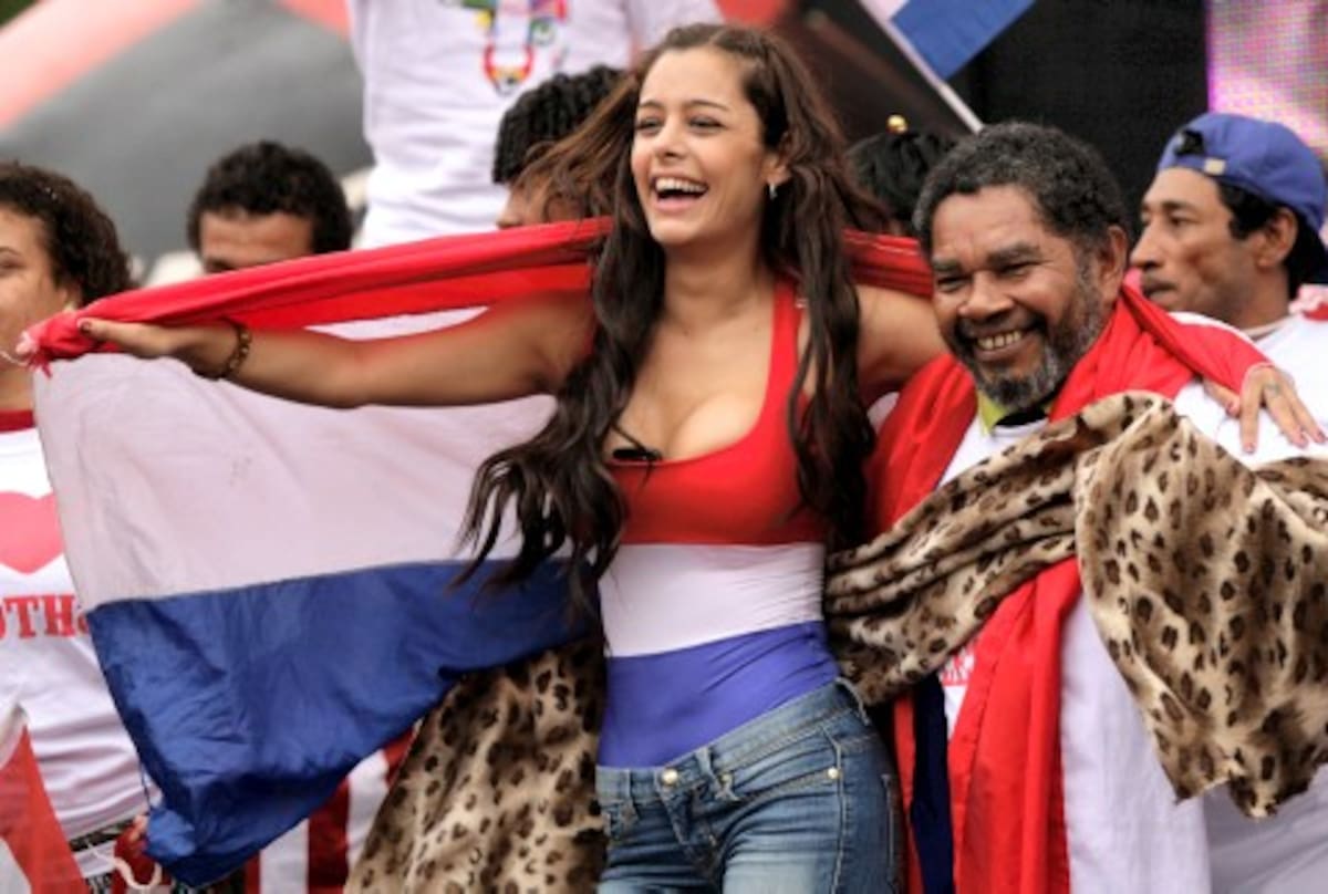 Paraguayan fan Larissa Riquelme celebrates after Paraguay beat Japan during a South Africa 2010 World Cup soccer match as they watch the game in a big screen in the downtown square of Asuncion, Tuesday, June 29, 2010. Paraguay moves on to the quarter finals.(AP Photo/Jorge Saenz)