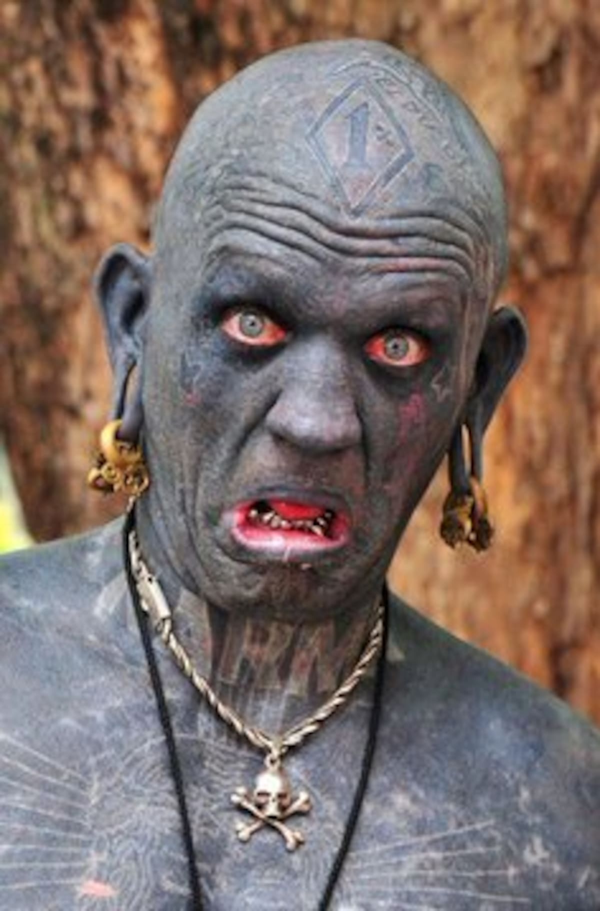 Lucky Diamond Rich es el hombre más tatuado del mundo.