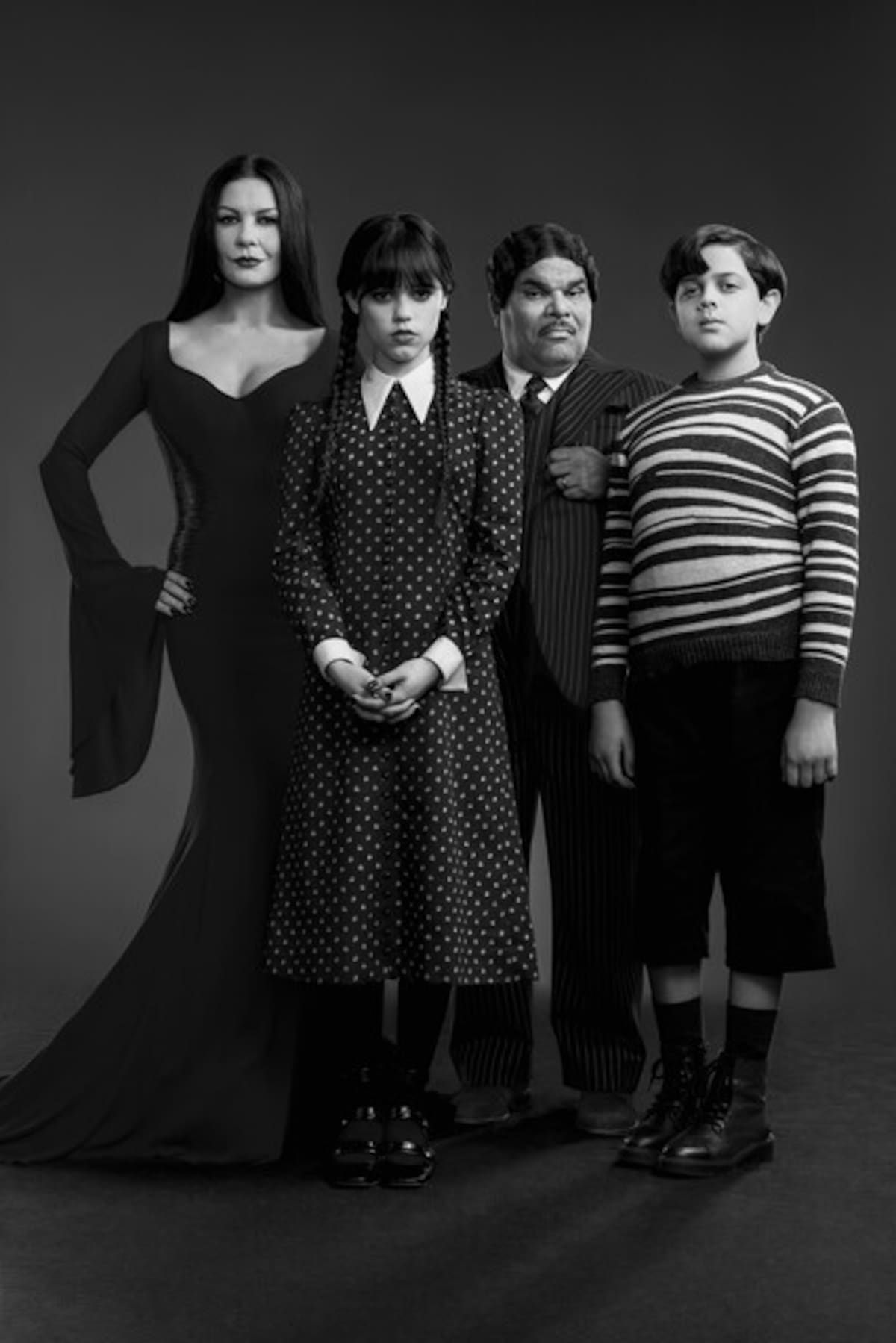 Catherine Zeta-Jones as Morticia Adams, Jenna Ortega as Wednesday Addams, Luis Guzma?n as Gomez Addams, Issac Ordonez as Pugsley Addams in Wednesday.
