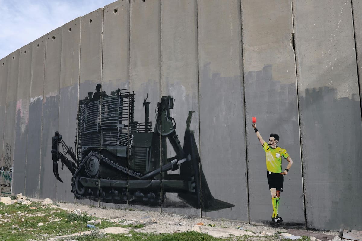 BETHLEHEM (---), 13/02/2026.- A graffiti painted on the separation wall, at Aida refugee camp youth center pitch in the West Bank city of Bethlehem, 13 February 2026. Local Palestinian artist Taqi Sbetin, has created a graffiti on the separation wall in protest against the Israeli military order issued for the demolition of the playground in the youth center. (Protestas) EFE/EPA/ATEF SAFADI
