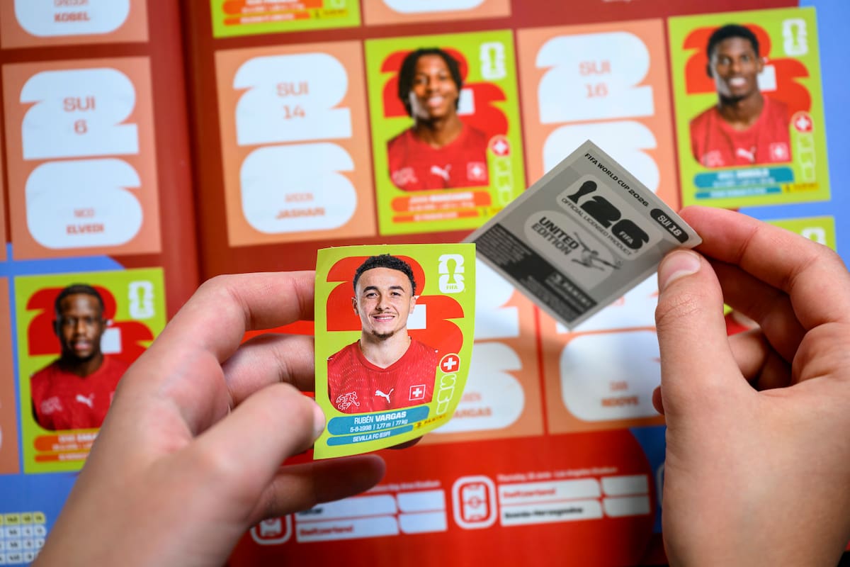 LAUSANNE (Switzerland), 12/05/2026.- A young collector sticks a Panini World Cup sticker of Switzerland's national soccer team player Ruben Vargas in the official Panini album of the FIFA World Cup 2026, in Lausanne, Switzerland, 12 May 2026. (Mundial de Fútbol, Suiza) EFE/EPA/LAURENT GILLIERON
