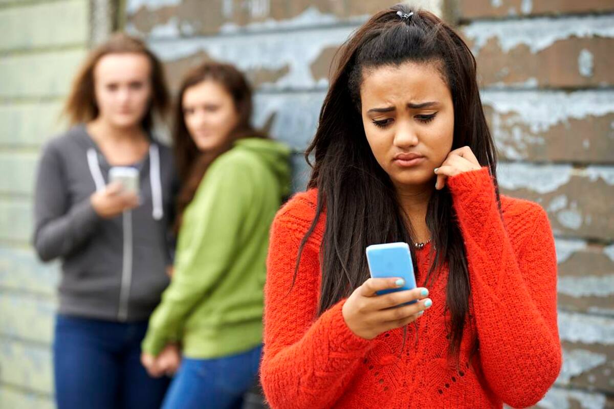 Teenage Girl Being Bullied By Text Message