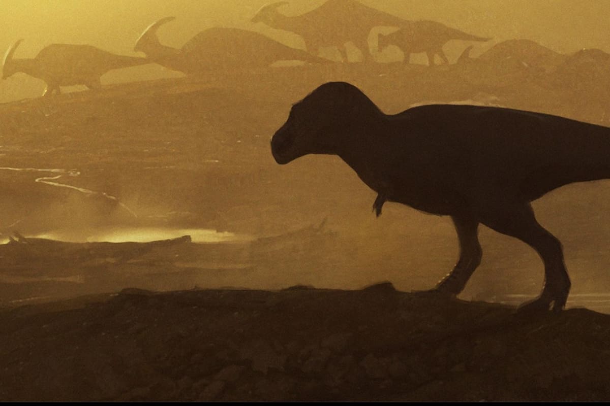 Representación artística de un tiranosaurio gigante camina mientras es observado, desde el fondo, por dinosaurios pico de pato Parasaurolophus. Nuevo México, Cretácico tardío, hace 74-75 millones de años. Crédito: Chase Stone/Imagen cedida por Scientific Reports