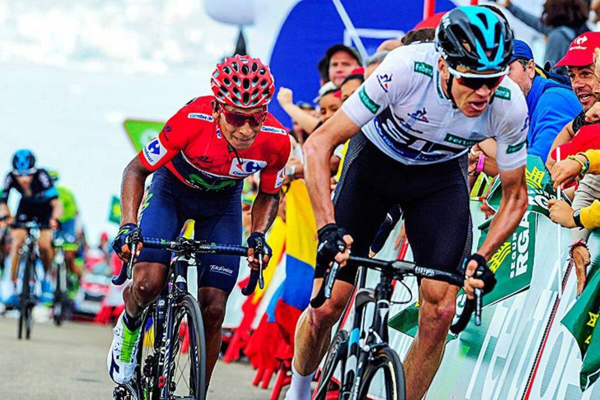 El pedalista colombiano Nairo Quintana (rojo) durante una lucha en carretera con el británico Chris Froome en la Vuelta a España. (Foto: COLPRENSA/VANGUARDIA LIBERAL)